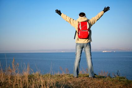 traveler on top of a mountain ridge