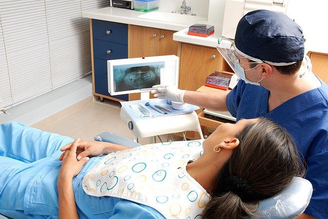 dentist talking with patient